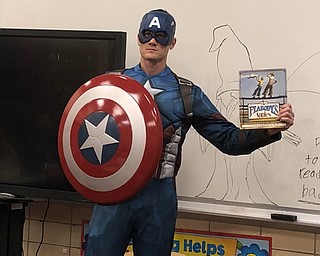 Neighbors | Submitted.Stadium Drive invited numerous guest readers to their school for Right to Read Week. The entire week had an overarching theme of superheroes, while each day had another specific theme. Pictured, a superhero read to students on May 11.