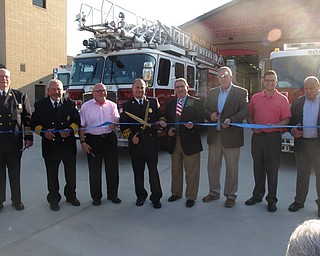 Neighbors | Zack Shively.Members of the Boardman Fire Department and Boardman’s Trustee Board cut the ribbon on station 71, opening it for use. The building will house 14 people and six of the department's vehicles during the day.