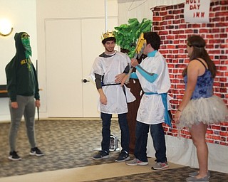 Neighbors | Jessica Harker.From left, the Green Knight faced off with King Arthur, Sir Gawain and Guinevere, all played by local high school students, during the preformance of the Tales of King Arthur at Austintown library.
