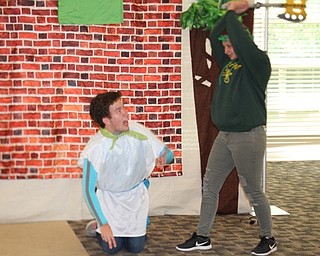 Neighbors | Jessica Harker.The Green Knight attacked Sir Gawain, both played by local high school students, on June 18 at the Austintown library.