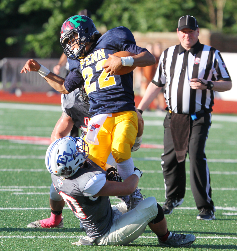 William D. Lewis The Vindicator Penn's Caleb Collins(22) of Rochester is wrapper up by Ohio's Michael Loy(10) of EastLiverpool during 6-28-18 Penn Ohio game in Salem.