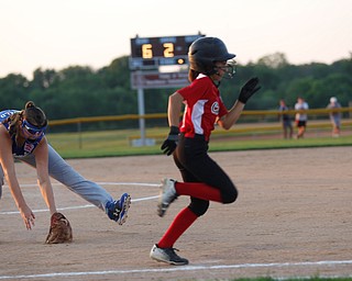 Poland's Katie McDonald fields the ball as Canfield's Gianna Pannanzio runs past during the district championship game on Sunday.