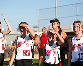 Canfield's 10u softball team cheers to the crowd after winning against Austintown during a tournament game on Sunday.