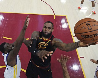 FILE - In this June 6, 2018, file photo, Cleveland Cavaliers' LeBron James shoots against Golden State Warriors' Draymond Green during the first half of Game 3 of basketball's NBA Finals, in Cleveland. The Philadelphia 76ers are getting a chance to pitch their process to LeBron James. Representatives from the team will meet Sunday with Jamesâ€™ agent Rich Paul in Los Angeles, a person familiar with the get together told the Associated Press on condition of anonymity because of the sensitivity of the talks.Â James, who returned to Los Angeles from vacation on Sunday, July 1, 2018, before NBA free agency opened, will not take part in the meeting, the person said. (Gregory Shamus/Pool Photo via AP, File)