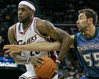 Minnesota Timberwolves' Marko Jaric (55) tries to stop Cleveland Cavaliers' LeBron James (23) in the first quarter of an NBA basketball game Friday, Nov. 17, 2006, in Cleveland. (AP Photo/Tony Dejak)