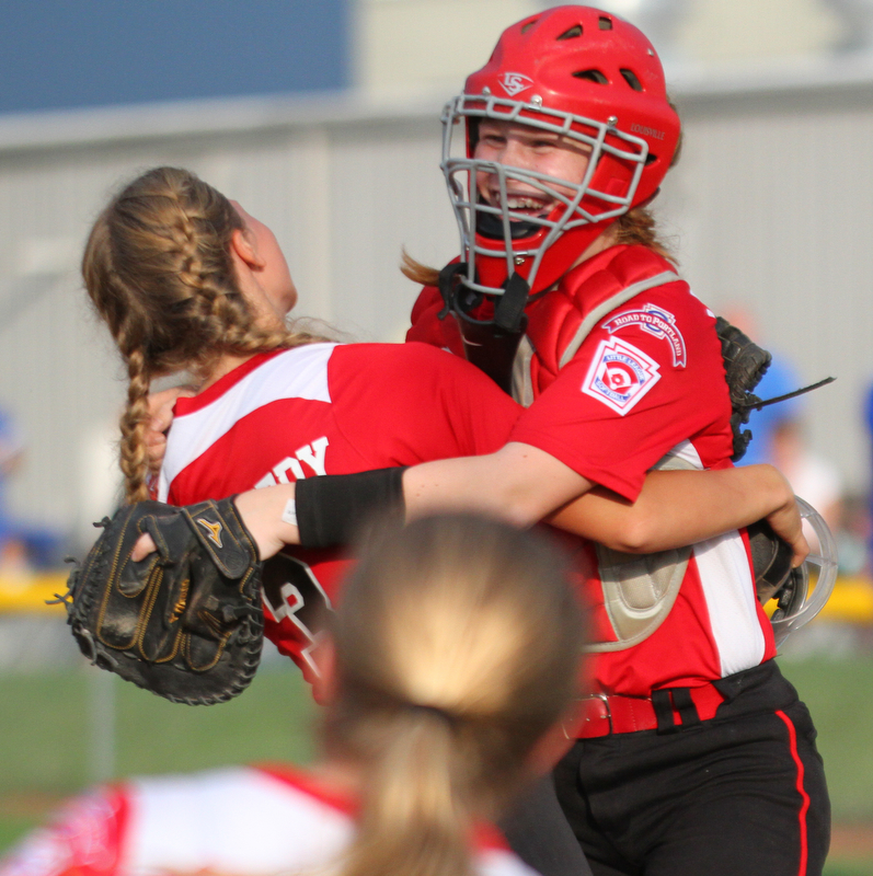 William D. Lewis The Vindicator  Canfield pitcher Bella Kennedy(3) left, gets congrats from catcher(12) after 7-2-18 win over Poland at Fields of Dreams.