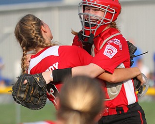 William D. Lewis The Vindicator  Canfield pitcher Bella Kennedy(3) left, gets congrats from catcher(12) after 7-2-18 win over Poland at Fields of Dreams.