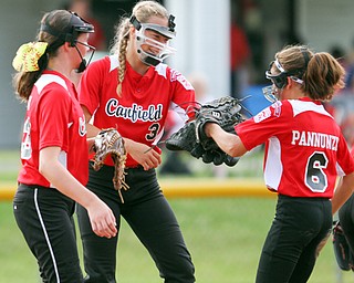 William D. Lewis The Vindicator  Canfield pitcher Bella Kennedy(3) gets congrats from (23) left, and (6) during 7-2-18 win over Poland at Fields of Dreams.