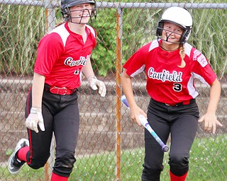 William D. Lewis The Vindicator  Canfield(1) and (3) react after scoring during 7-2-18 win over Poland at Fields of Dreams.