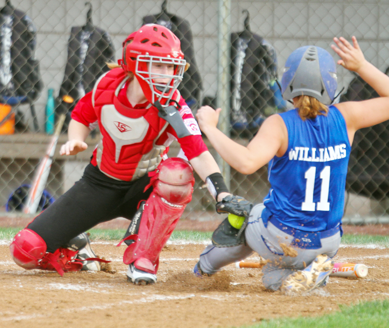 William D. Lewis The Vindicator  Canfield catcher(12) tags Poland's( 11)during 7-2-18 win over Poland at Fields of Dreams.