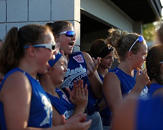 Poland's 12u softball team cheers as its teammates get called onto the field at the beginning of the district championship game against Canfield on Sunday.