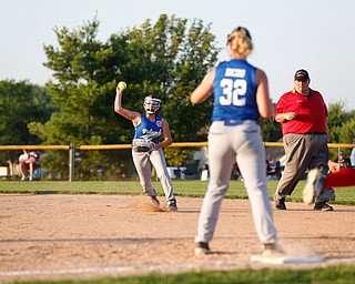 Poland's Gia Schiavone tries to throw Canfield's Emma Campbell out at first, during the district championship game against on Sunday.