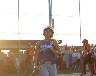 Poland's Sophia D'Angelo heads to the dugout after scoring during the district championship game against Canfield on Sunday.