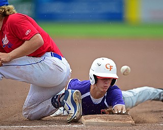 STRUTHERS, OHIO - JULY 3, 2018: Creekside' Kyle Weitzel dives into first while Avalanche' Jamin Wentling misplays the ball in the second inning of a baseball game, Tuesday, July 3, 2018 in Struthers. Weitzel would advance to second. DAVID DERMER | THE VINDICATOR