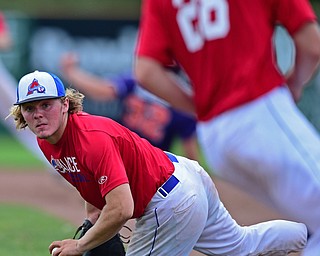 STRUTHERS, OHIO - JULY 3, 2018: Avalanche' Jamin Wentling looks to flip the ball to starting pitcher Garrett Brewer in the second inning of a baseball game against XXX, Tuesday, July 3, 2018 in Struthers. DAVID DERMER | THE VINDICATOR