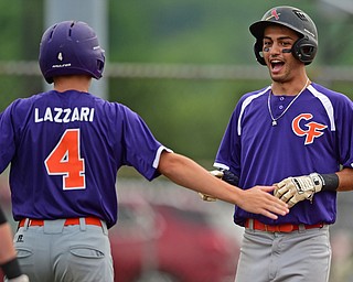 STRUTHERS, OHIO - JULY 3, 2018: Creekside' Alex Hernandez, right, is congratulated by Clay Lazzari after scoring in the second inning of a baseball game against Avalanche, Tuesday, July 3, 2018 in Struthers. DAVID DERMER | THE VINDICATOR