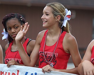 McKenna DePascquale (14) of the Struthers cheer squad waves to spectators during the Struthers Fourth of July Parade on Wednesday afternoon.  Dustin Livesay  |  The Vindicator  7/4/18  Struthers