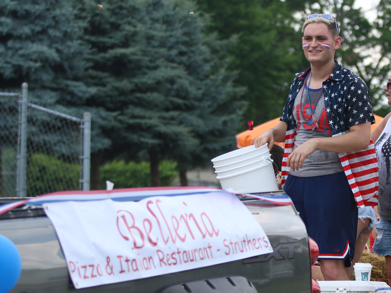 Brian Vulcan throws out candy while on the Belleria float during the Struthers Fourth of July Parade on Wednesday afternoon.  Dustin Livesay  |  The Vindicator  7/4/18  Struthers