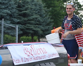 Brian Vulcan throws out candy while on the Belleria float during the Struthers Fourth of July Parade on Wednesday afternoon.  Dustin Livesay  |  The Vindicator  7/4/18  Struthers