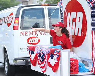 Gina Gabriele throws out candy while on the Nemenez IGA float during the Struthers Fourth of July Parade on Wednesday afternoon.  Dustin Livesay  |  The Vindicator  7/4/18  Struthers