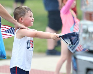 Colin Hallquist (4) of Struthers holds out his hat for candy during the Struthers Fourth of July Parade on Wednesday afternoon.  Dustin Livesay  |  The Vindicator  7/4/18  Struthers