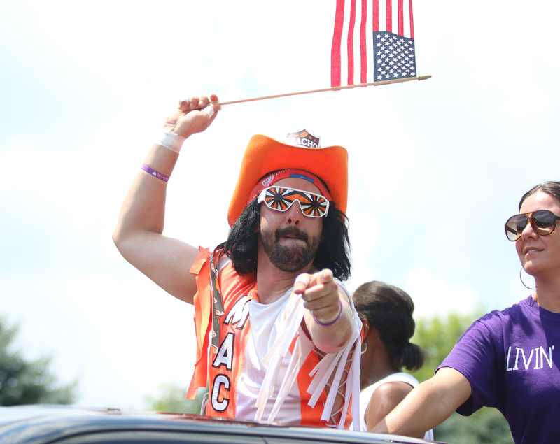 Dan Lancy of Struthers waves a flag while dressed up as former wrestling star "Macho Man Randy Savage" during the Struthers Fourth of July Parade on Wednesday afternoon.  Dustin Livesay  |  The Vindicator  7/4/18  Struthers