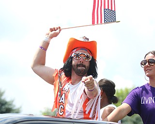 Dan Lancy of Struthers waves a flag while dressed up as former wrestling star "Macho Man Randy Savage" during the Struthers Fourth of July Parade on Wednesday afternoon.  Dustin Livesay  |  The Vindicator  7/4/18  Struthers