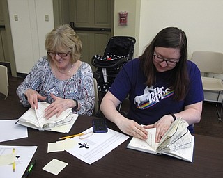 Neighbors | Zack Shively.Amy Burkard organized the Boardman library's book folding event. She taught those in attendance how to fold the books and find designs online for future use. The program gave those crafting a chance to socialize while making their projects. Pictured, Joyce Noble and Melanie Fannin worked on their crafts at the program.