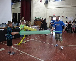 Neighbors | Zack Shively.Each day of Stadium Drive's STEM event began with an assembly by OH WOW! The Roger and Gloria Jones Children's Center for Science and Technology. Ralf Urbach, from the science center, led the assembly. He also set up a station during the STEM program.