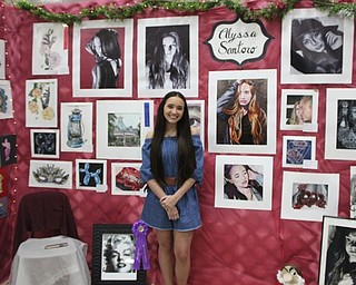 Neighbors | Abby Slanker.Canfield High School senior AP art student and Canfield Local Schools Student Art Show second runner up Alyssa Santoro created a booth with her artwork for the art show on May 23.