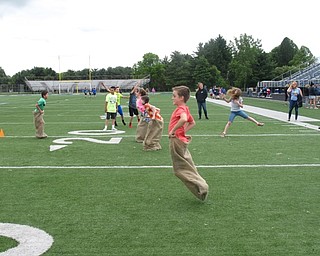 Neighbors | Zack Shively.The Dobbins Elementary Fun Day gave the students an exciting way to end the last school year at Dobbins Elementary. They had fun activities inside and outside of the school, such as the sack race pictured.