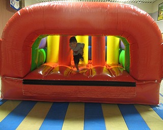 Neighbors | Zack Shively.Dobbins Elementary set up a bounce around station in their gymnasium for the school's fun day on June 3. The students had a relay race through the bounce house. They also had a magician visit the school to entertain the students.