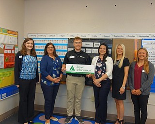 Neighbors | Submitted.Junior Achievement of Mahoning Valley wrapped up the 2017-2018 school year by teaching 132 first-grade students at Poland Union Elementary School the JA Our Families curriculum. Pictured are, from left, Anna Brocker, Jennifer Gasser, Robert Brand, Rachel Leedy, Bre Machingo and Taylor Amato.