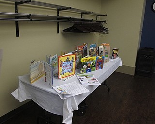 Neighbors | Jessica Harker .A display of books, all to do with reducing, reusing and recycling for children, sat at the June 20 Rock Out with the Green Team event at the Boardman library.
