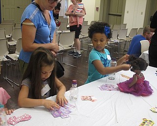 Neighbors | Jessica Harker .Julia Glenellen and Elle Barnes added stickers to their shakers at the June 20 Rock Out with the Green Team event.