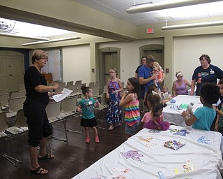 Neighbors | Jessica Harker .Peg Flynn led a sing-a-long with the children joining in with their shakers during the Rock Out with the Green Team event on June 20.