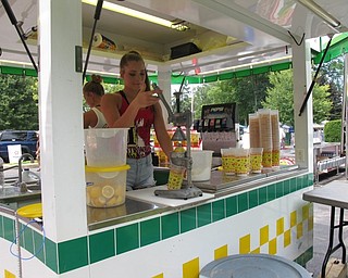 Neighbors | Jessica Harker.Kaitlyn Totani made hand squeezed lemonade at one of the many vending options at Celebrate Poland on June 29 and 30.