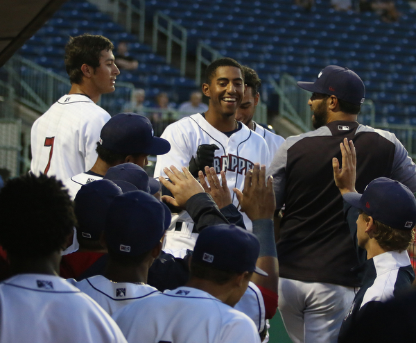 Richie Palacios (17) of the Scrappers (center) gets greeted by his teammates in the dugout after hitting a home run during the bottom of the first inning against .batavia at Eastwood Field on Thursday evening. Dustin Livesay  |  The Vindicator  7/5/18  Niles