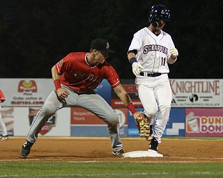 Clark Scolamiero (11) of the Scrappers steps back to first base beating the tag by Batavia first basemen Sean Reynolds (25) during the bottom of the second inning at Eastwood Field on Thursday evening. Dustin Livesay  |  The Vindicator  7/5/18  Niles