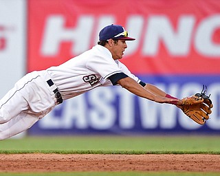 NILES, OHIO - JULY 6, 2018: Mahoning Valley Scrappers' Tyler Freeman dives in a unsuccessful attempt to prevent a base hit by Batavia Muckdogs' Denis Karas in the third inning of a baseball game against the Batavia Muckdogs, Friday, July 6, 2018, in Niles. DAVID DERMER | THE VINDICATOR