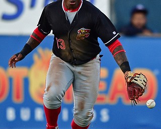 NILES, OHIO - JULY 6, 2018: Batavia Muckdogs' Albert Guaimaro watches as the ball hits the ground after he dropped the ball allowing Mahoning Valley Scrappers' Tre Gantt to reach base in the third inning of a baseball game against the Batavia Muckdogs, Friday, July 6, 2018, in Niles. DAVID DERMER | THE VINDICATOR