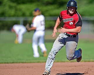 STRUTHERS, OHIO - JULY 7, 2018: KnightLine's Kevin Pollock runs to third base on a double by Kole Klasic in the first inning of a baseball game against Astro, Saturday, July 7, 2018, in Struthers. DAVID DERMER | THE VINDICATOR
