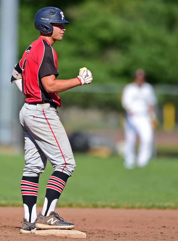 STRUTHERS, OHIO - JULY 7, 2018: KnightLine's Kole Klasic pumps his first after hitting a double in the first inning of a baseball game against Astro, Saturday, July 7, 2018, in Struthers. DAVID DERMER | THE VINDICATOR