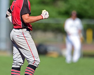 STRUTHERS, OHIO - JULY 7, 2018: KnightLine's Kole Klasic pumps his first after hitting a double in the first inning of a baseball game against Astro, Saturday, July 7, 2018, in Struthers. DAVID DERMER | THE VINDICATOR