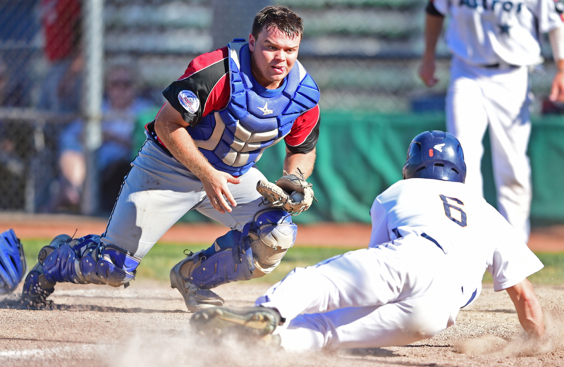 STRUTHERS, OHIO - JULY 7, 2018: Knightline's Tim Herberger, left, prepares to tag out Astro's Marco Defalco in the third inning of a baseball game against KnightLine, Saturday, July 7, 2018, in Struthers. DAVID DERMER | THE VINDICATOR