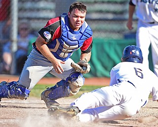 STRUTHERS, OHIO - JULY 7, 2018: Knightline's Tim Herberger, left, prepares to tag out Astro's Marco Defalco in the third inning of a baseball game against KnightLine, Saturday, July 7, 2018, in Struthers. DAVID DERMER | THE VINDICATOR