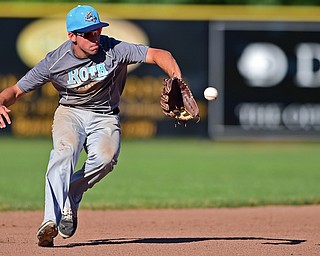 STRUTHERS, OHIO - JULY 7, 2018: Roth Brothers' Christian Gabriel field the ball before throwing to first for the out in the fourth inning of a baseball game against Baird Brothers, Saturday, July 7, 2018, in Struthers. DAVID DERMER | THE VINDICATOR