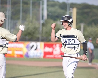 Baird Brothers' Andrew Russell, right, and Jacob Keene fist bump after Russell scores in the second inning of the Class B tournament game against Knightline on Tuesday.