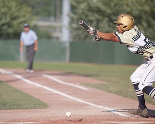 Baird Brothers' Dayln Brickner lays down a bunt during the third inning of the Class B tournament game against Knightline on Tuesday.