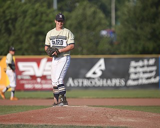 Baird Brothers' Andrew Russell smiles after pitching a strike in the fourth inning of the Class B tournament game against Knightline on Tuesday.